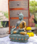 athepoo- an antique green buddha statue