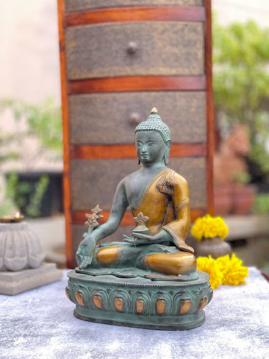 athepoo- an antique green buddha statue