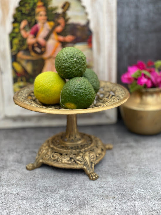 athepoo- A brass fruit stand with oranges